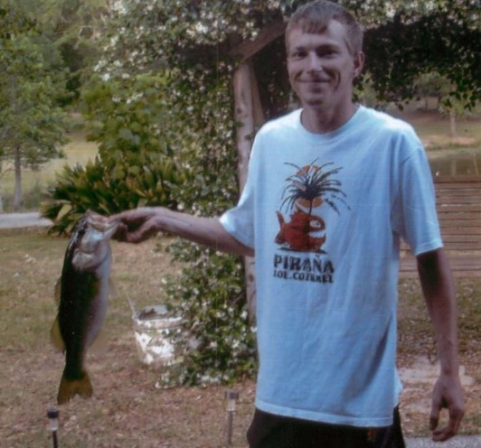 Joshua Duncan holding a fish