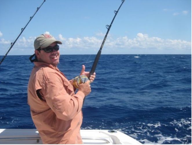 Brian Simpson fishing on a boat