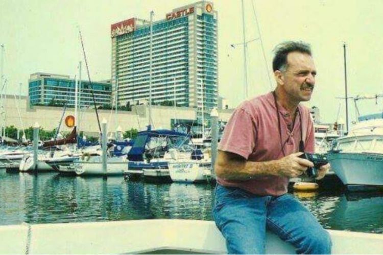 a younger Daniel Burroughs on a boat