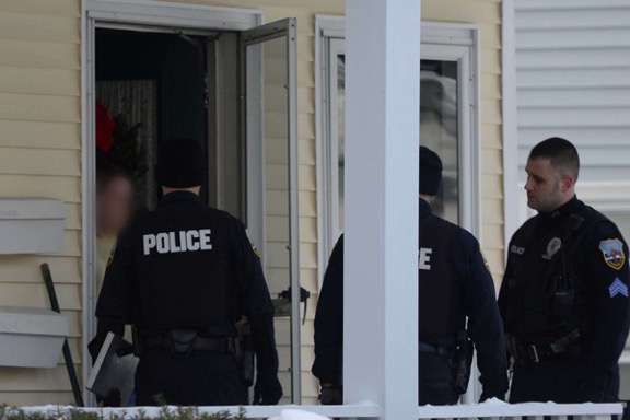police officers outside a home