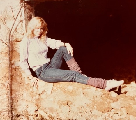 Liz Lowe posting on a rock