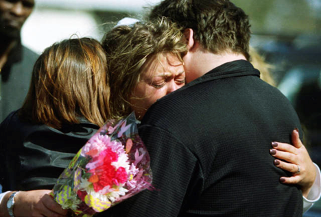 People hugging one day after shooting