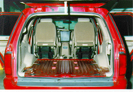 looking into the open hatch of a red car