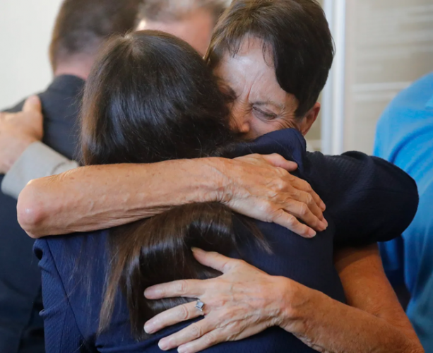 Jan Cornell (left) is embraced by State Attorney Amira Fox, after Zieler sentenced