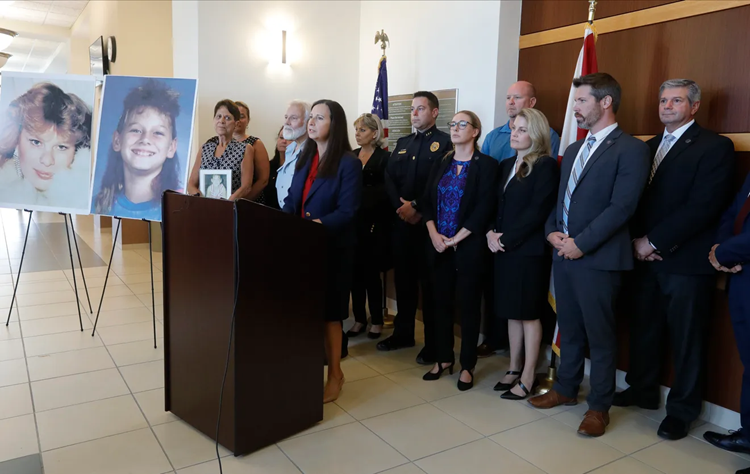 Press conference after Zieler sentenced, State Attorney Amira Fox at podium, Jan Cornell next to photos of Lisa Story (l) and her daughter Robin Cornell (rt)